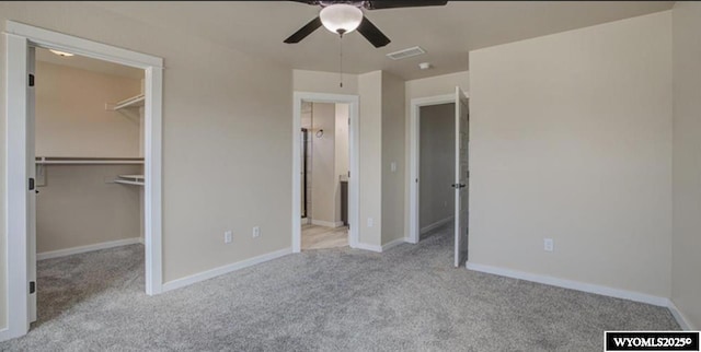 827 Dusty Ter, Mills, WY 82604 - unfurnished bedroom with carpet, a walk in closet, and baseboards