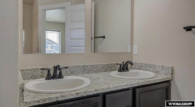 827 Dusty Ter, Mills, WY 82604 - full bath with double vanity and a textured wall