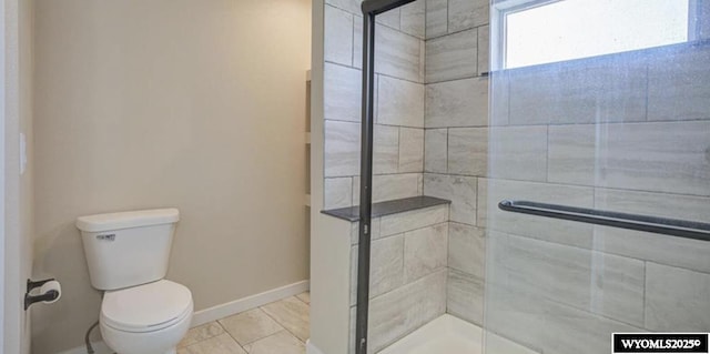 827 Dusty Ter, Mills, WY 82604 - bathroom with a stall shower, toilet, and baseboards