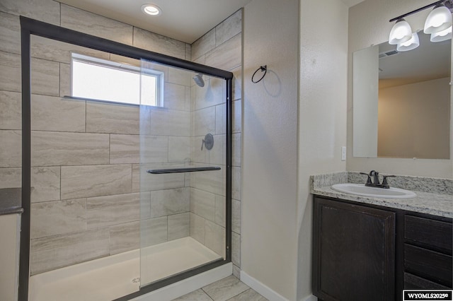 827 Dusty Ter, Mills, WY 82604 - bathroom with vanity, a shower stall, tile patterned flooring, and baseboards