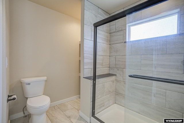 827 Dusty Ter, Mills, WY 82604 - bathroom featuring toilet, a shower stall, and baseboards