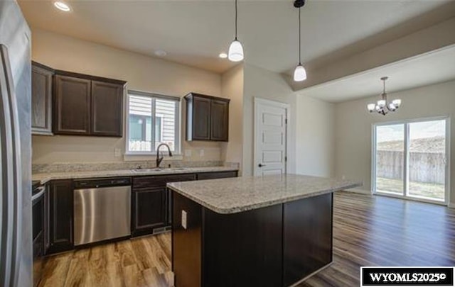 827 Dusty Ter, Mills, WY 82604 - kitchen with appliances with stainless steel finishes, a sink, healthy amount of natural light, light wood-type flooring, and recessed lighting
