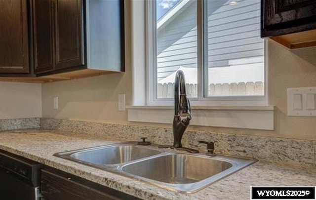 827 Dusty Ter, Mills, WY 82604 - kitchen featuring a sink, dark brown cabinets, and dishwasher