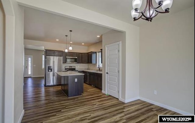 827 Dusty Ter, Mills, WY 82604 - kitchen with appliances with stainless steel finishes, a center island, dark wood-style floors, a chandelier, and recessed lighting
