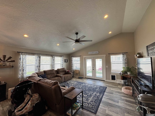 3440 Summit, Rock Springs, WY 82901 - living room featuring a ceiling fan, vaulted ceiling, a textured ceiling, plenty of natural light, and wood finished floors