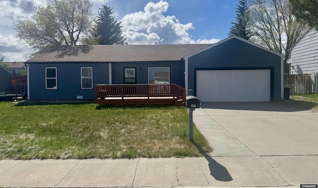 2318 Inverness Blvd, Rawlins, WY 82301 - ranch-style home with a garage, concrete driveway, and a deck