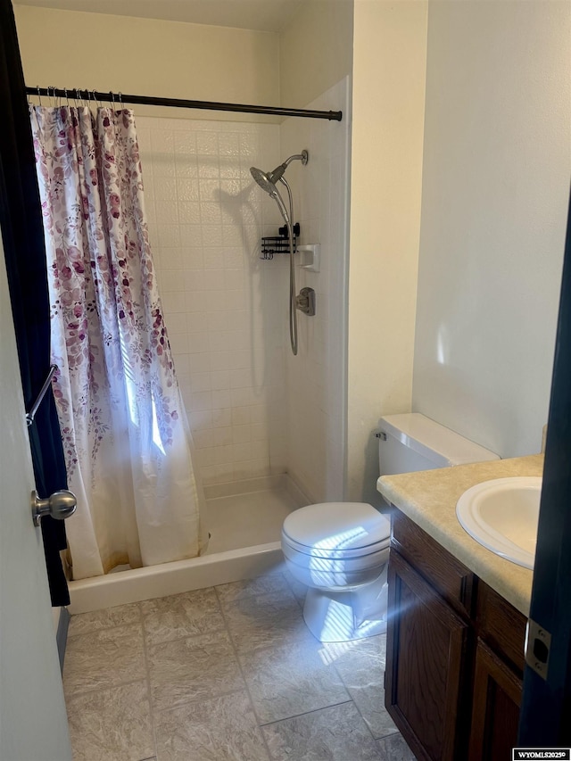 2318 Inverness Blvd, Rawlins, WY 82301 - bathroom with toilet, tiled shower, and vanity