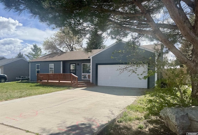 2318 Inverness Blvd, Rawlins, WY 82301 - ranch-style home featuring a garage, driveway, and a front lawn