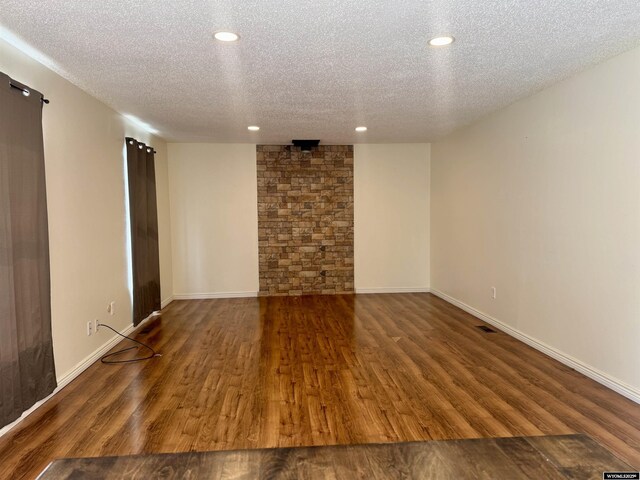 2318 Inverness Blvd, Rawlins, WY 82301 - spare room with a textured ceiling, recessed lighting, wood finished floors, and baseboards