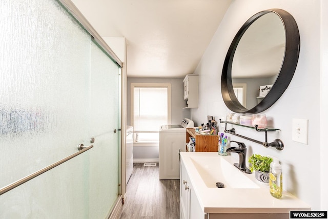 195 W Gatchell, Buffalo, WY 82834 - full bath with wood finished floors, vanity, a shower stall, and a bath