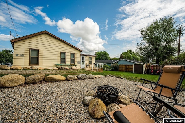 195 W Gatchell, Buffalo, WY 82834 - back of house featuring a fire pit and a patio