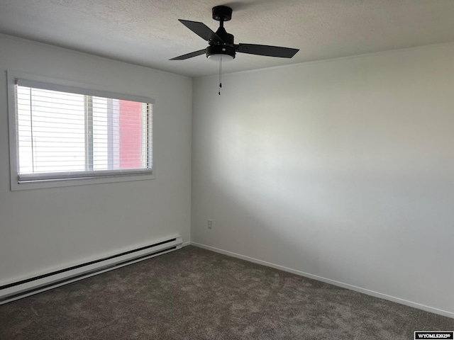 1821 Edinburgh St, Rawlins, WY 82301 - unfurnished room with a baseboard heating unit, a textured ceiling, dark carpet, ceiling fan, and baseboards