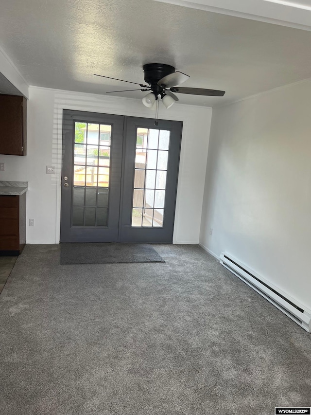 1821 Edinburgh St, Rawlins, WY 82301 - unfurnished living room with baseboard heating, carpet flooring, and ceiling fan