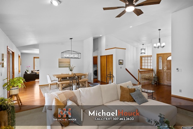 2001 Newport, Casper, WY 82609 - living room with a chandelier, washer / clothes dryer, wood finished floors, a ceiling fan, and high vaulted ceiling