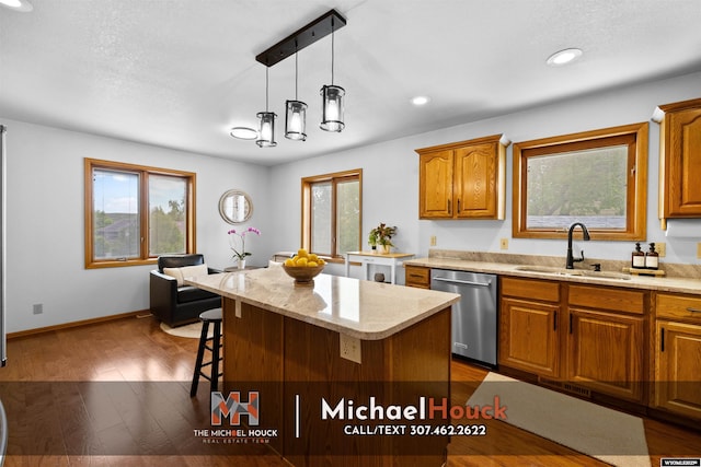 2001 Newport, Casper, WY 82609 - kitchen featuring dishwasher, a sink, brown cabinetry, plenty of natural light, and recessed lighting