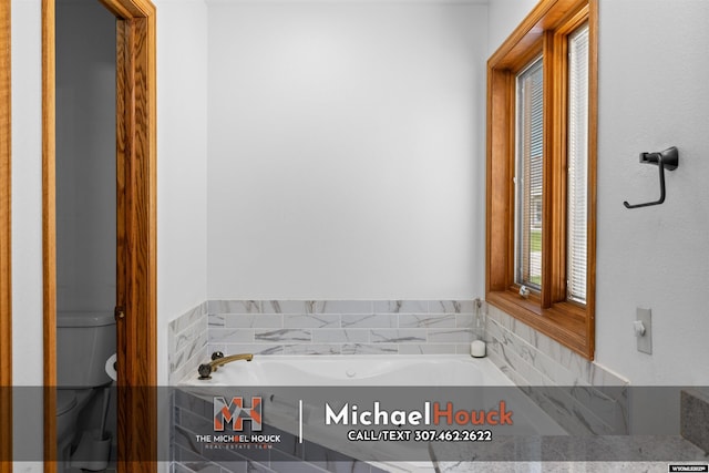 2001 Newport, Casper, WY 82609 - bathroom featuring toilet and a garden tub