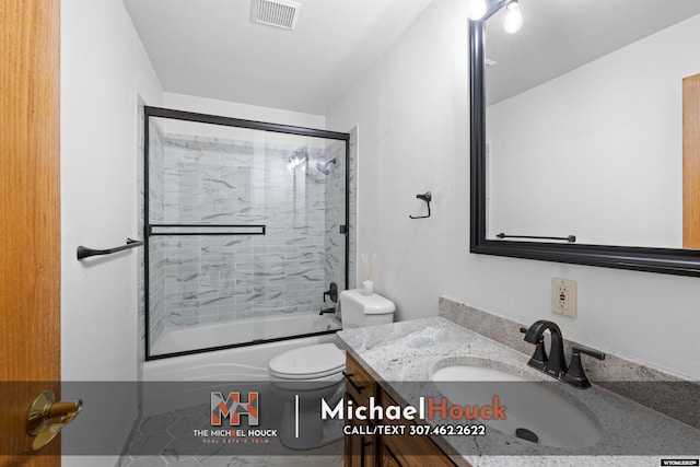 2001 Newport, Casper, WY 82609 - full bathroom with vanity, combined bath / shower with glass door, and toilet