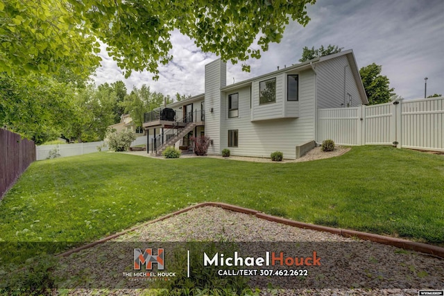 2001 Newport, Casper, WY 82609 - view of yard featuring stairs, a wooden deck, and a gate