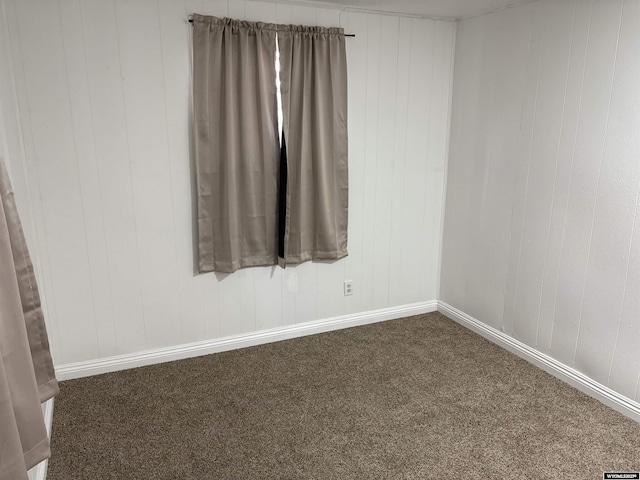 808 E Adams Ave, Riverton, WY 82501 - empty room featuring dark colored carpet and baseboards