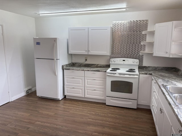 808 E Adams Ave, Riverton, WY 82501 - kitchen with white appliances, white cabinets, open shelves, dark wood-style flooring, and a sink
