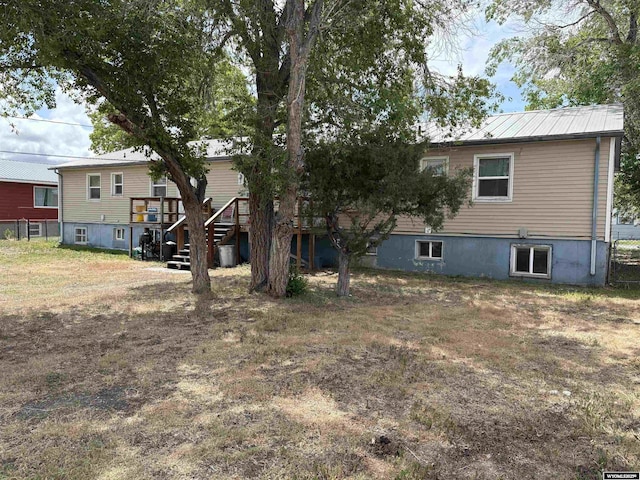 808 E Adams Ave, Riverton, WY 82501 - back of house with stairs and a wooden deck