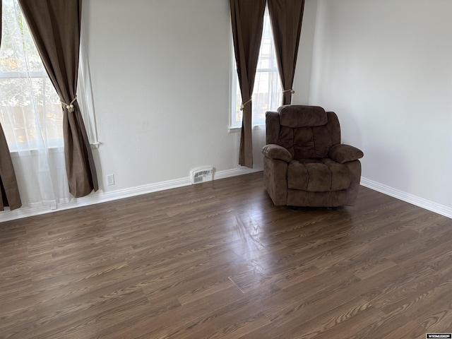 808 E Adams Ave, Riverton, WY 82501 - sitting room with dark wood-type flooring and baseboards