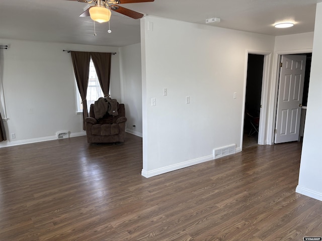 808 E Adams Ave, Riverton, WY 82501 - spare room with a ceiling fan, dark wood-style flooring, baseboards, and a smoke detector