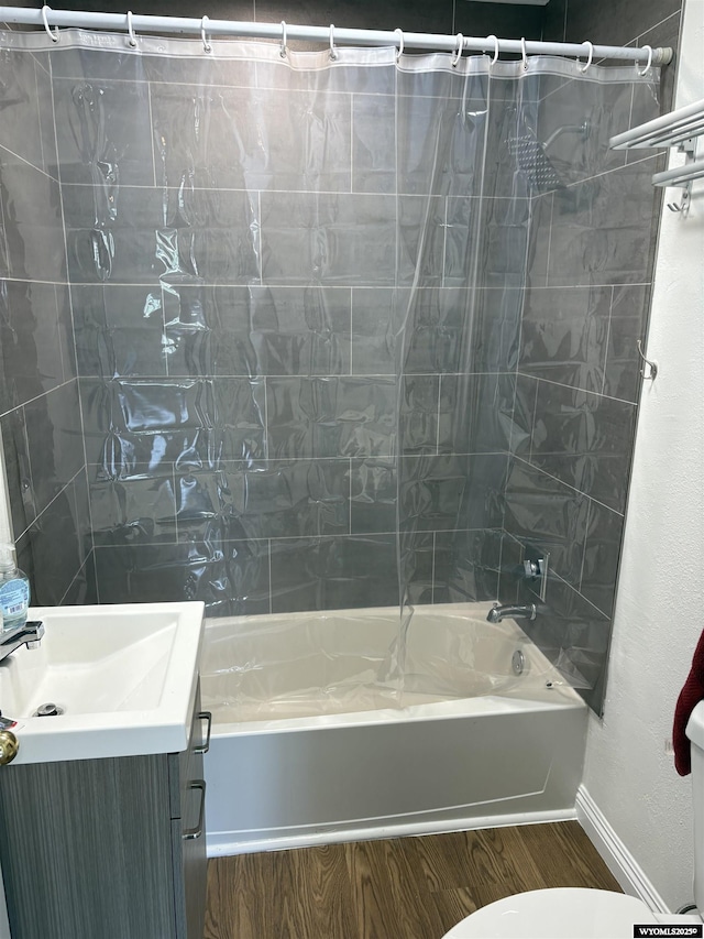 808 E Adams Ave, Riverton, WY 82501 - full bathroom with shower / bath combo, vanity, wood finished floors, baseboards, and toilet