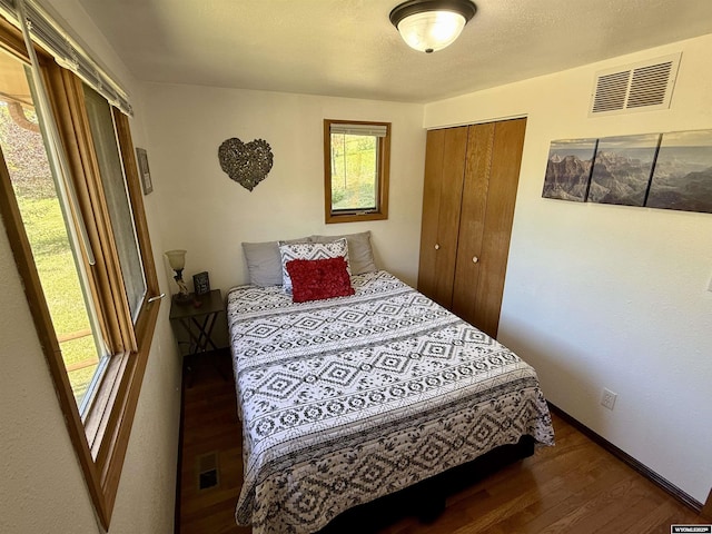 17512 US Highway 14, Carlile, WY 82721 - bedroom featuring wood finished floors, baseboards, and a closet