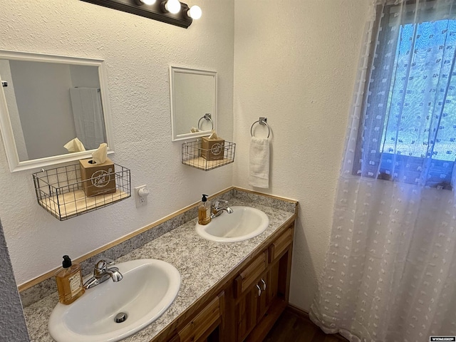 17512 US Highway 14, Carlile, WY 82721 - bathroom with double vanity and a textured wall