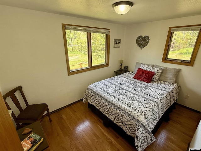 17512 US Highway 14, Carlile, WY 82721 - bedroom featuring wood finished floors and baseboards