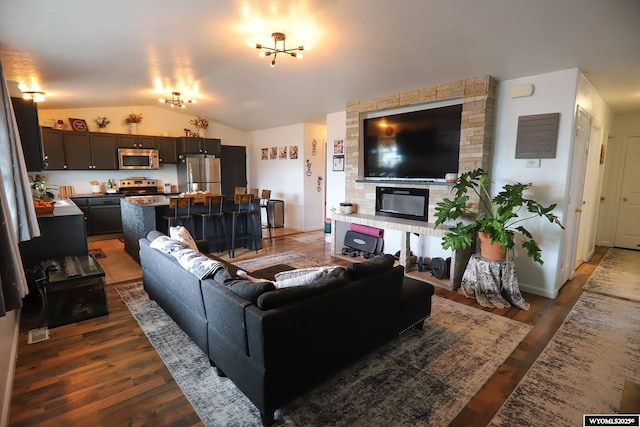 108 Tamari Dr, Buffalo, WY 82834 - living room with vaulted ceiling, wood finished floors, and baseboards