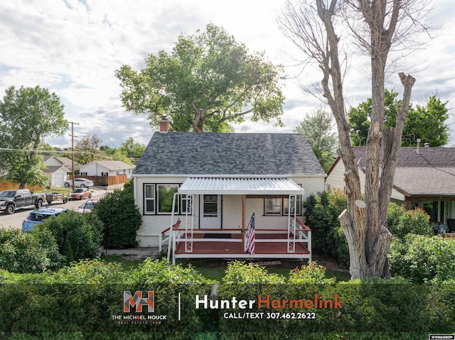 1314 S Wilson St, Casper, WY 82601 - view of front of home with a chimney, a shingled roof, and covered porch