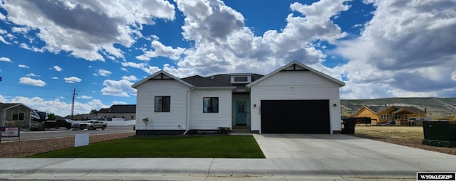 1400 Kaye Way, Rock Springs, WY 82901 - view of front of home with a front lawn, driveway, and an attached garage