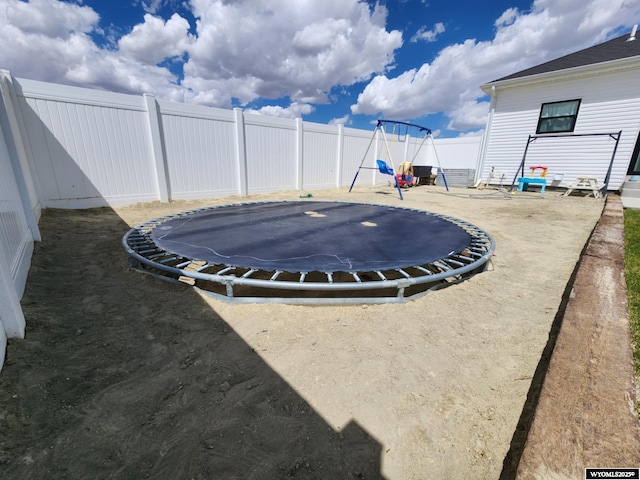 1400 Kaye Way, Rock Springs, WY 82901 - fenced backyard featuring a trampoline