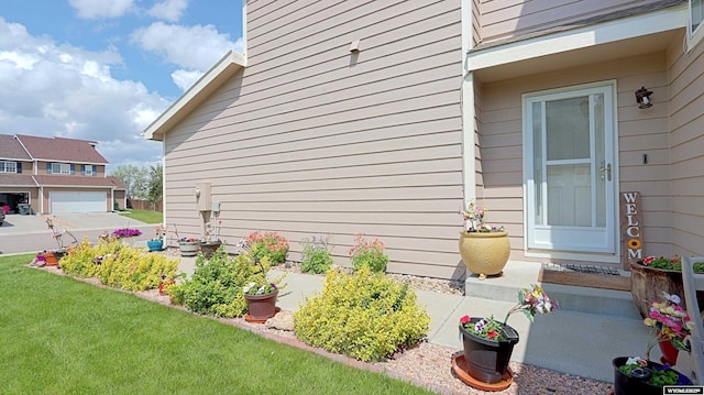 1141 Meadow Ln, Douglas, WY 82633 - view of exterior entry featuring a lawn