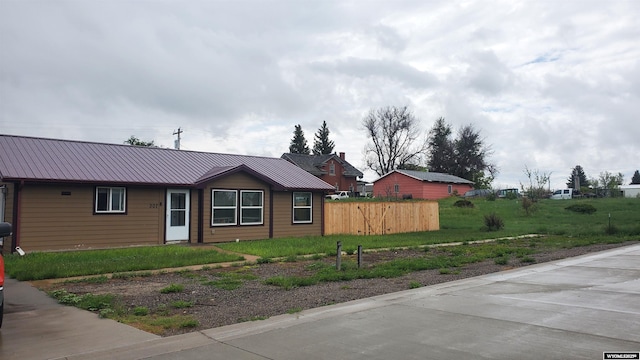 307 3rd St, Chugwater, WY 82210 - ranch-style home featuring metal roof