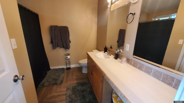 307 3rd St, Chugwater, WY 82210 - bathroom featuring vanity, toilet, baseboards, and a shower with curtain