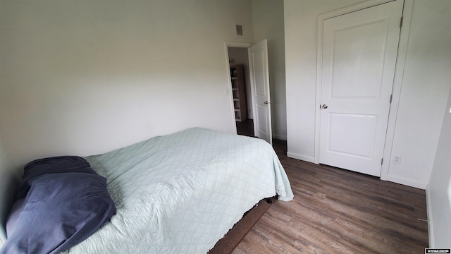 307 3rd St, Chugwater, WY 82210 - bedroom with dark wood-style floors and baseboards