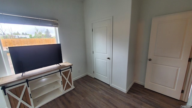 307 3rd St, Chugwater, WY 82210 - bedroom with dark wood finished floors and baseboards