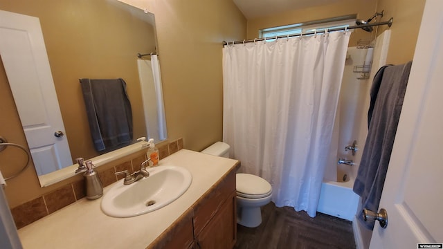 307 3rd St, Chugwater, WY 82210 - full bathroom with toilet, vanity, shower / bath combo with shower curtain, and decorative backsplash