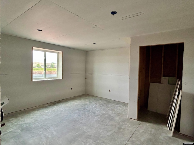 207 Eagle Dr, Greybull, WY 82426 - empty room with unfinished concrete flooring