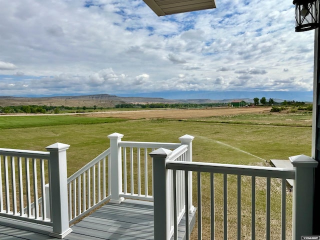 207 Eagle Dr, Greybull, WY 82426 - wooden deck with a rural view and a lawn
