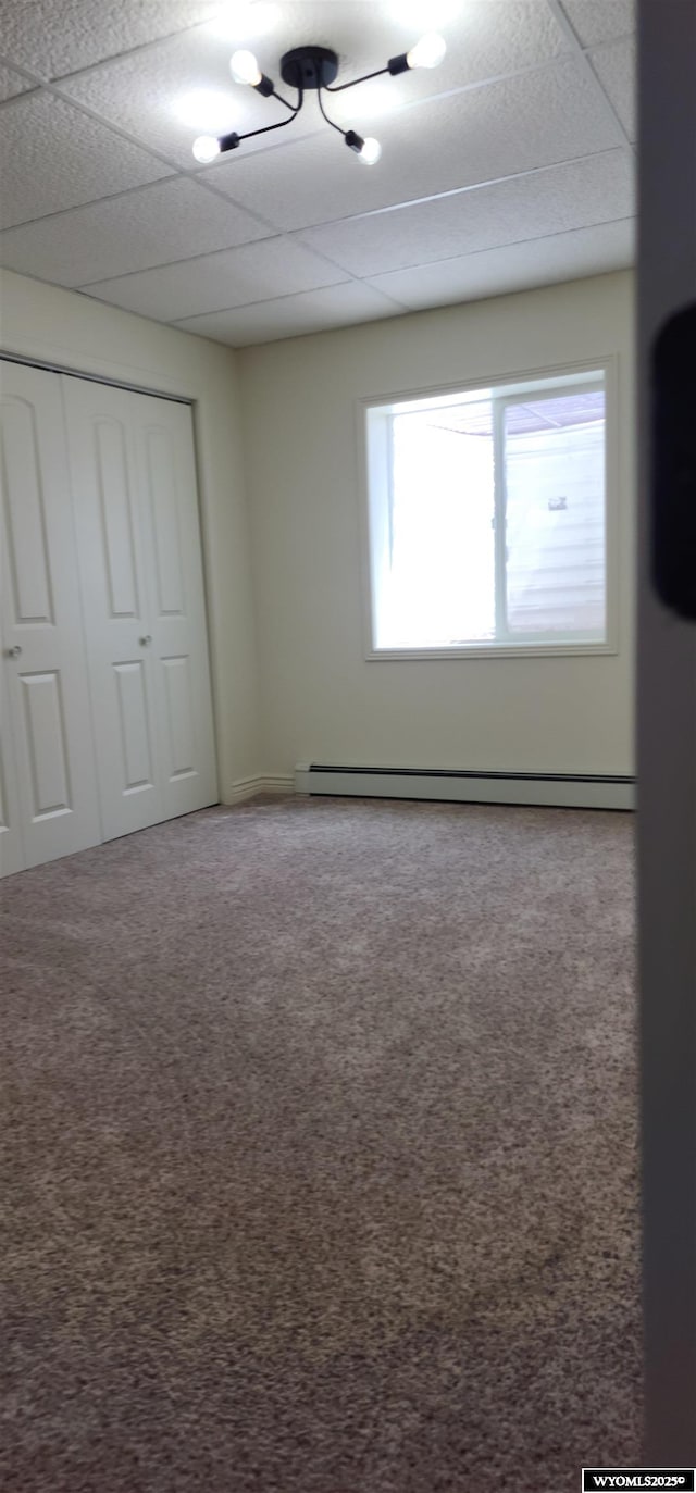 8 Amy Ln, Rock Springs, WY 82901 - unfurnished bedroom with a closet, a paneled ceiling, and carpet
