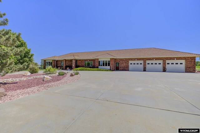 2867 Ardon Ln, Casper, WY 82609 - ranch-style home featuring driveway and an attached garage