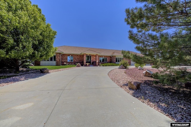 2867 Ardon Ln, Casper, WY 82609 - single story home with curved driveway and brick siding