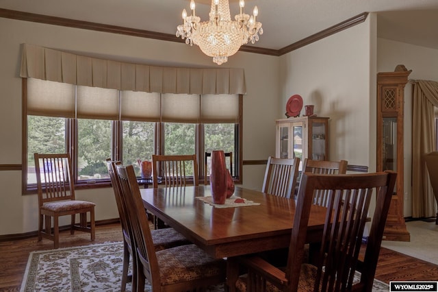 2867 Ardon Ln, Casper, WY 82609 - dining room featuring ornamental molding, wood finished floors, a chandelier, and baseboards