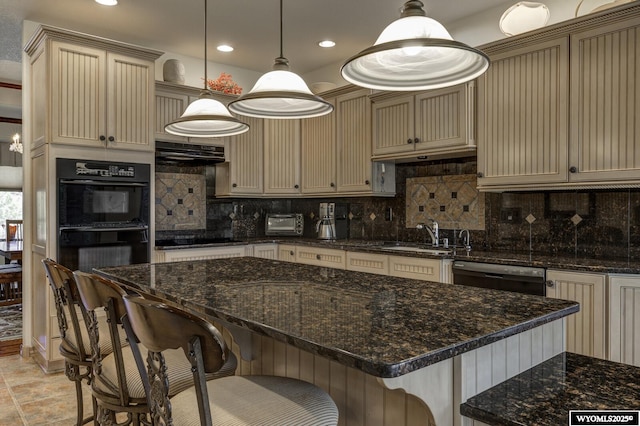2867 Ardon Ln, Casper, WY 82609 - kitchen featuring a sink, black appliances, backsplash, a kitchen breakfast bar, and recessed lighting