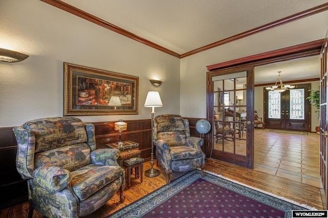 2867 Ardon Ln, Casper, WY 82609 - sitting room with crown molding, french doors, a wainscoted wall, and a chandelier