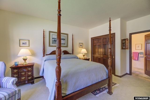 2867 Ardon Ln, Casper, WY 82609 - bedroom featuring light carpet, a closet, and baseboards